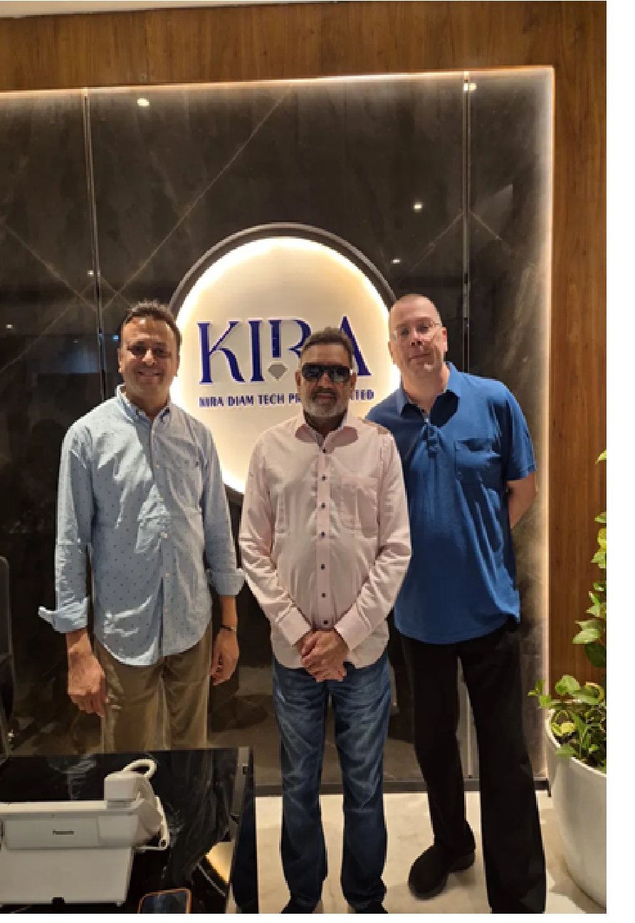 On-site meeting at Kira Diamonds in Surat on 30 January 2026 — left to right: Jayesh Savalia (TSR AI NANOZ Sensors Pvt. Ltd.), Vallabhbhai Patel (Kira / Kiran Diamonds), Michael Scheller (TSR Messtechnik AG) at the reception, in front of the KIRA logo.